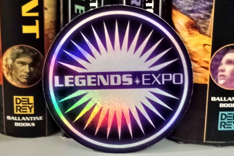 A Legacy Expo sticker up against a collection of Expanded Universe books.