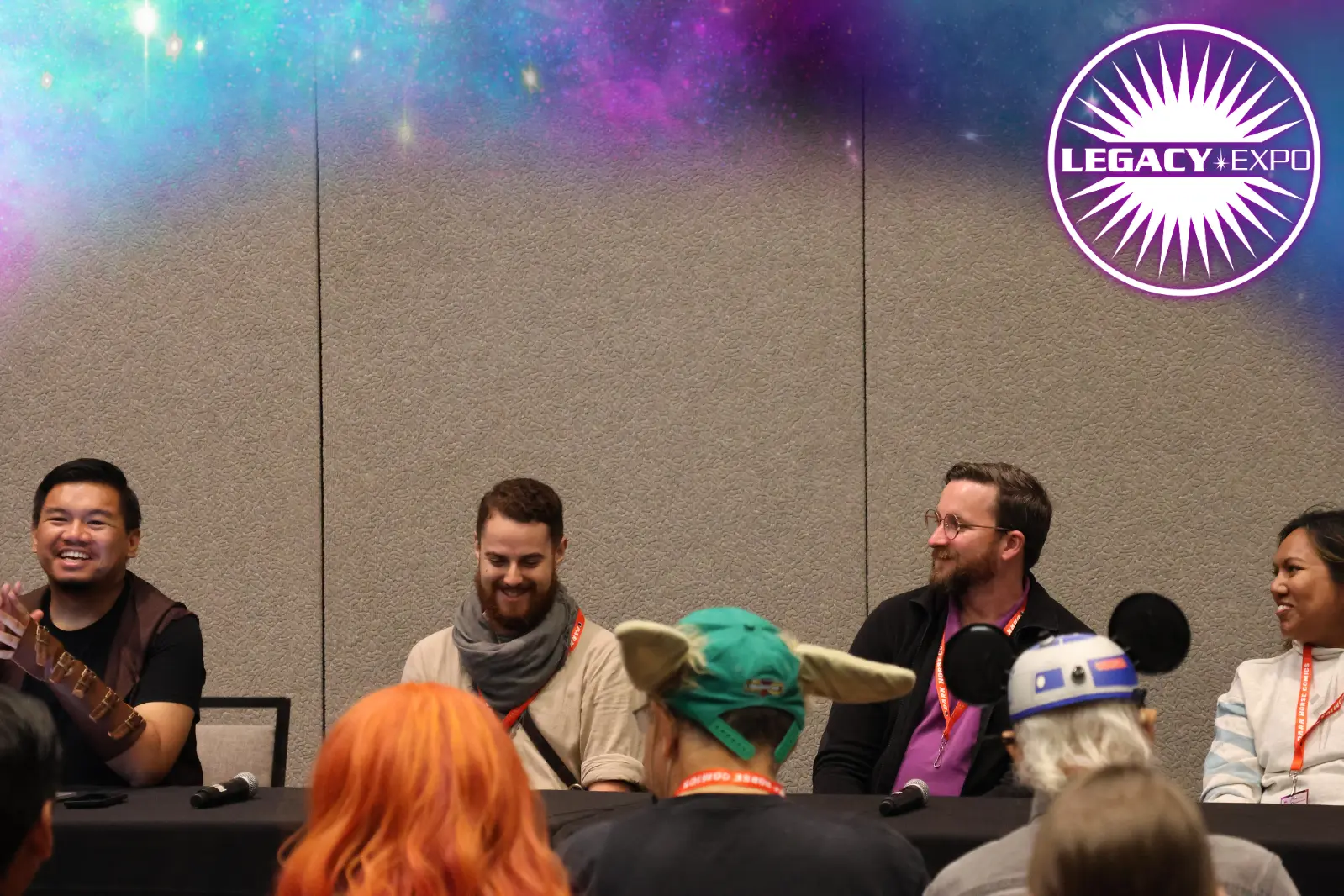 Fans sitting on a panel at Legacy Expo.