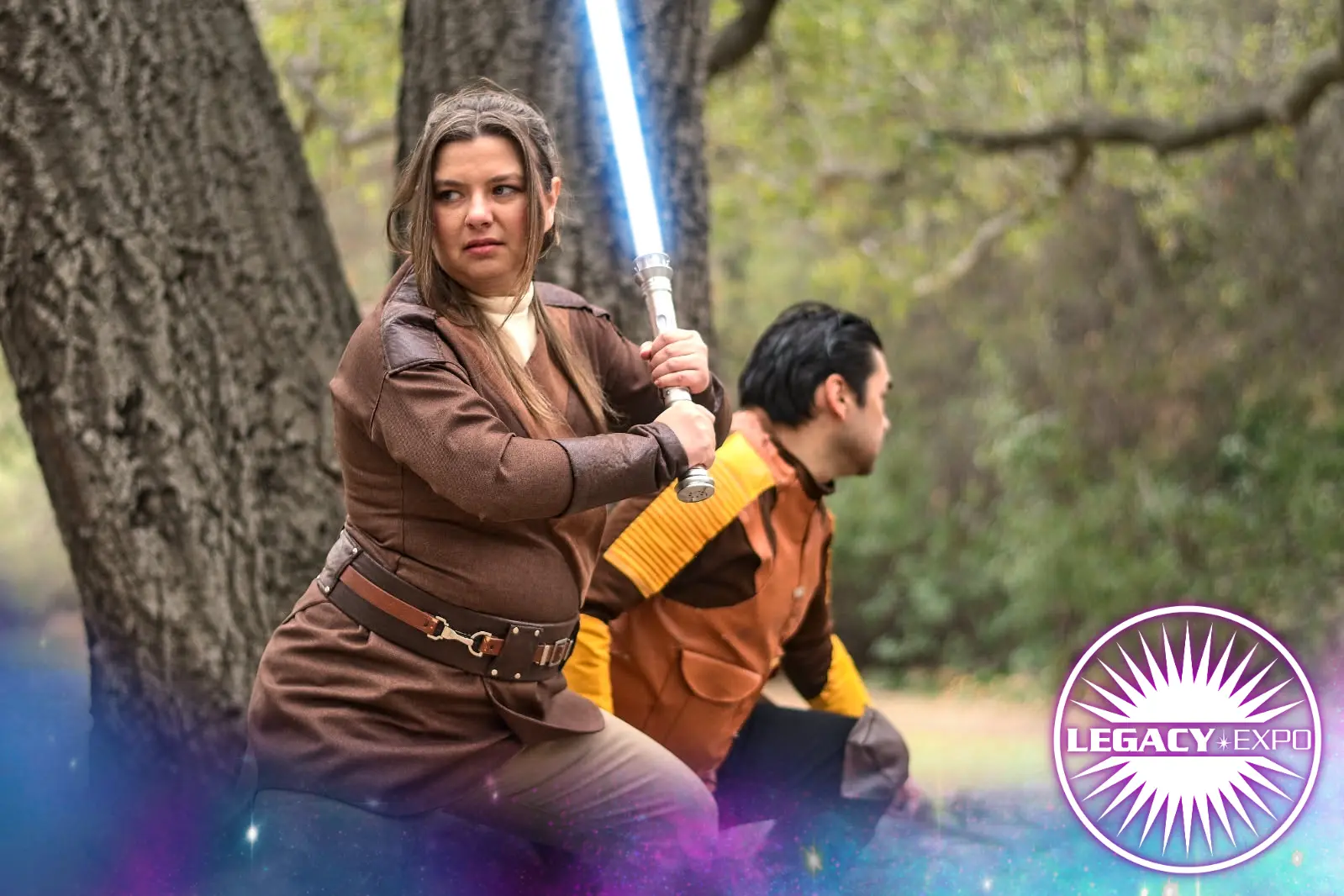 Cospalyers dressed as Old Republic characters posing as if they are in a battle.