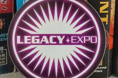 A Legacy Expo sticker up against a collection of Expanded Universe books.